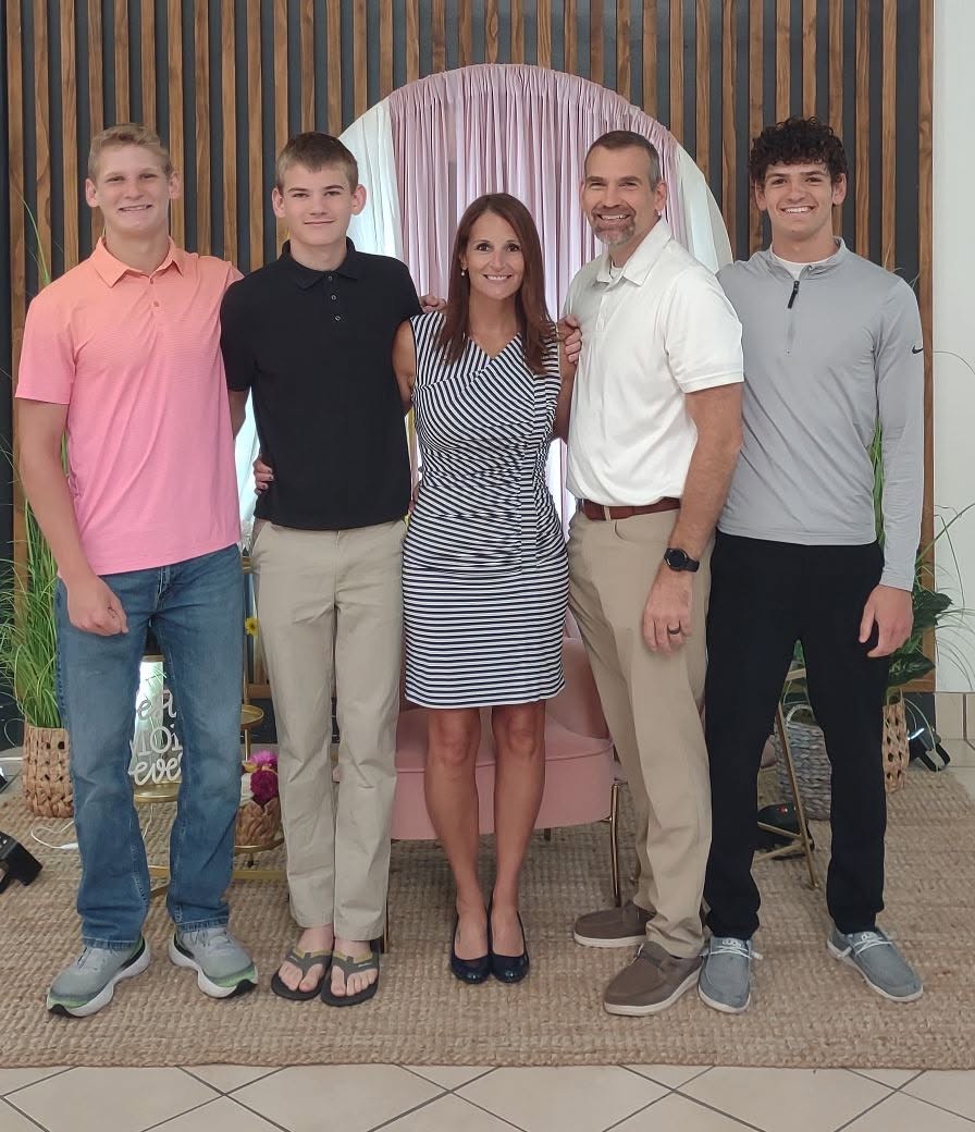 Lora Larcomb with her husband and three sons